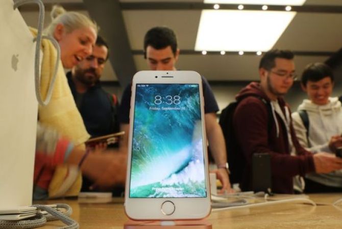 Apple iPhone sales fall, but beat estimates