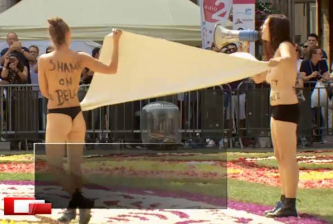 Активистки FEMEN устроили акцию на брюссельском цветочном ковре