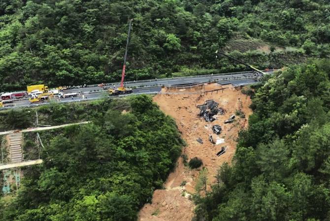 Death toll jumps to at least 48 in southern China highway collapse