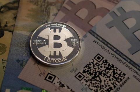 Bitcoin virtual currency breaks $1,000 mark