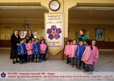 Signs devoted to Armenian Genocide Centennial posted on walls of Armenian organizations in Aleppo