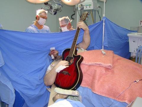 Brazilian man plays The Beatles on his guitar during brain surgery