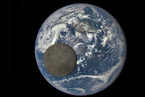 Space telescope catches moon crossing Earth from 'dark side'