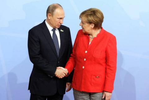 Putin, Merkel highlight importance of preserving Iran nuclear deal over phone