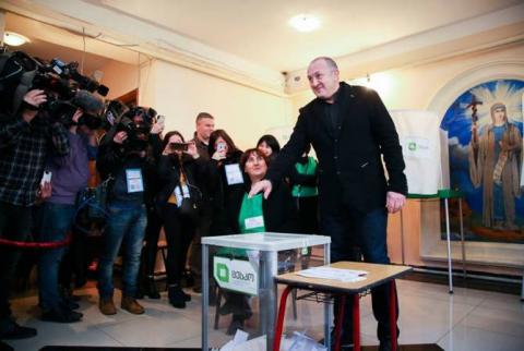 Georgia’s incumbent president casts vote in second round of election 