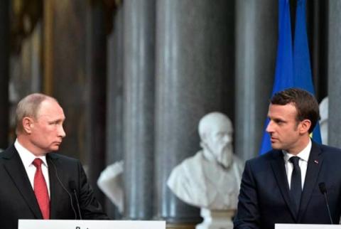Macron dénonce la "duplicité" de Poutine, sanctions françaises en vue