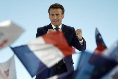 Macron leads first round of French election, to face Le Pen in run-off