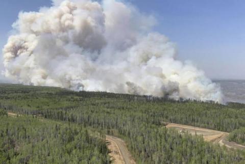 Thousands forced to evacuate as wildfires ravage western Canada