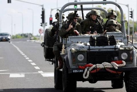 Israel's military says it has retaken control of all communities around Gaza