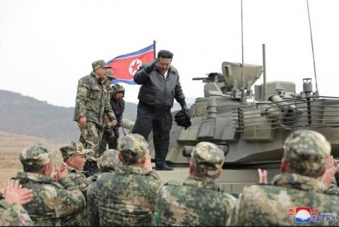 North Korea’s leader drives new tank during mock battle