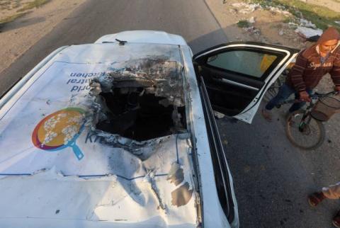 Charity boss says Israel targeted staff 'car bar car', Israel minister denies it