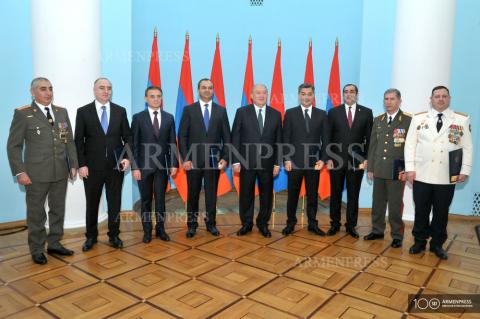 A group of officials bestowed with titles and class ranks at 
Presidential Palace 