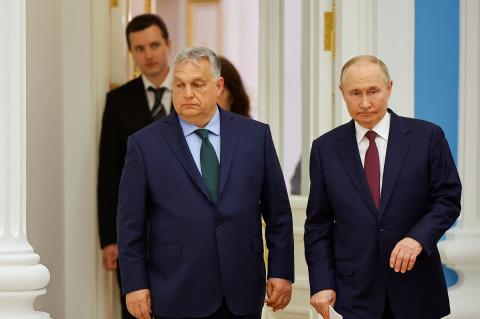 Hungary's Prime Minister Viktor Orban and Russia's President Vladimir Putin arrive for a press conference following their meeting in Moscow, Russia July 5, 2024. REUTERS/Evgenia Novozhenina
