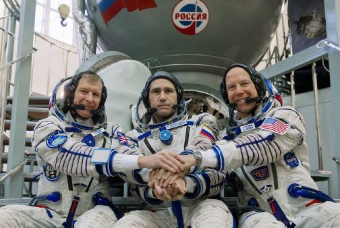 3-man Space Station crew comes back to Earth, as Soyuz craft lands in Kazakhstan
