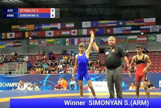 Armenian wrestler S. Simonyan defeats Azerbaijan’s Z. Zeynalov at Junior World Championship 