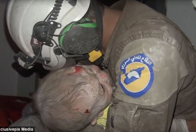 Syrian rescue worker breaks down in tears after pulling girl out of rubble alive