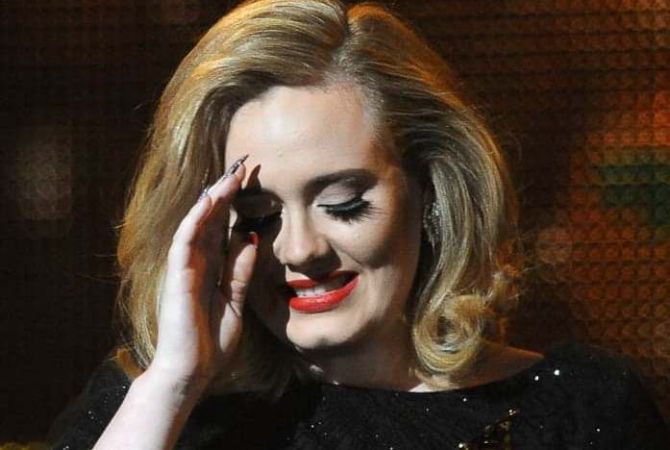 Adele suspends music career