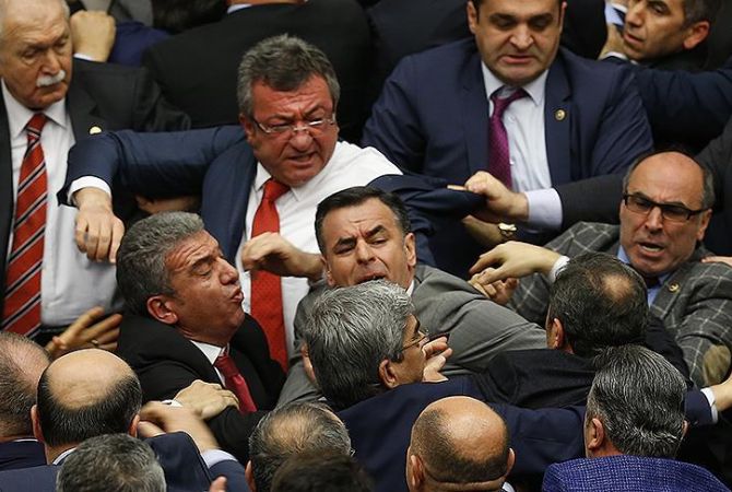 Voting on constitutional changes interrupted in Turkey’s Parliament by fights between 
lawmakers