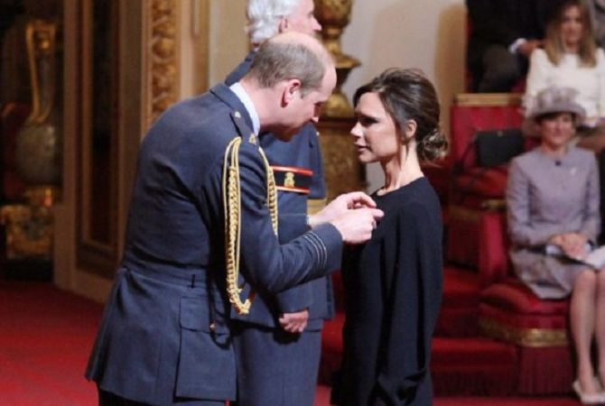 Victoria Beckham receives Order of the British Empire from Prince William 