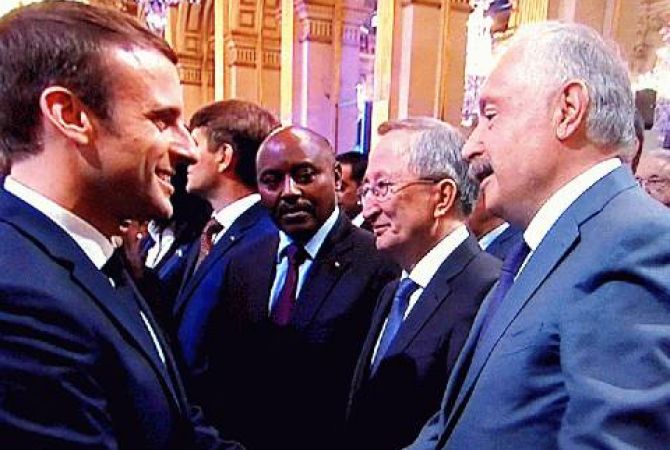 Macron warmly greets Vigen Chitechyan at a reception given for him