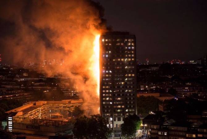 Flames engulf residential building in London