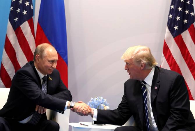First Trump-Putin meeting proceeds for more than an hour