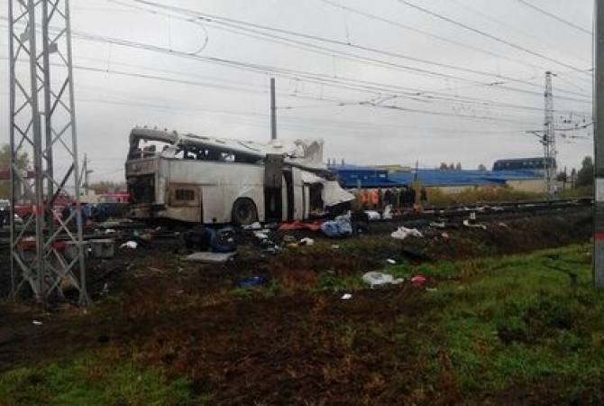 Train plows into bus in Russia, at least 21 dead