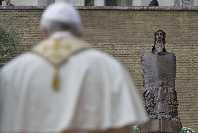 Pope Francis bows before newly-inaugurated St. Gregory of Narek statue in Vatican 