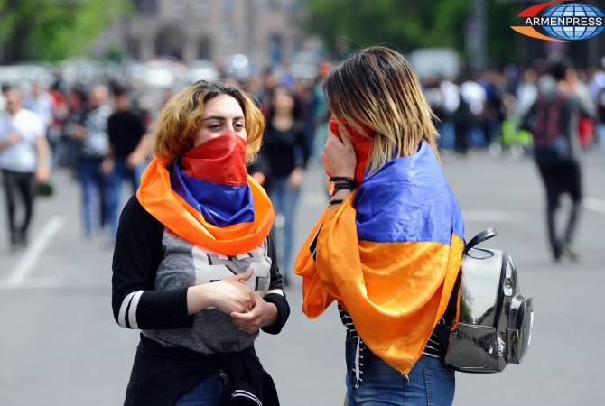 Yerevan police restore traffic in downtown street as demonstrators continue marching