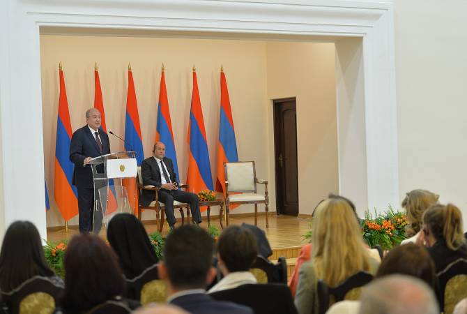 President Armen Sarkissian, Albert Boghossian hand in Presidential Awards
