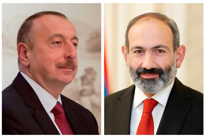Vladimir Putin introduces Armenian PM Nikol Pashinyan and Azerbaijani President Ilham Aliyev 
to one another in Moscow