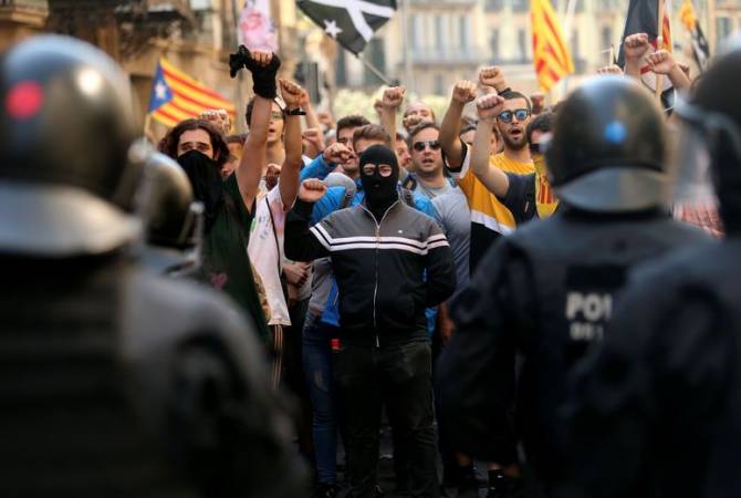 Dozens of police officers injured in Catalonia protests  