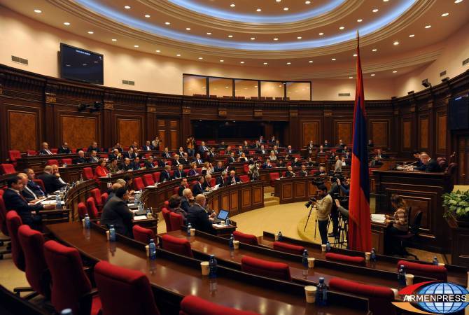 Parliament adopts controversial law under massive protests