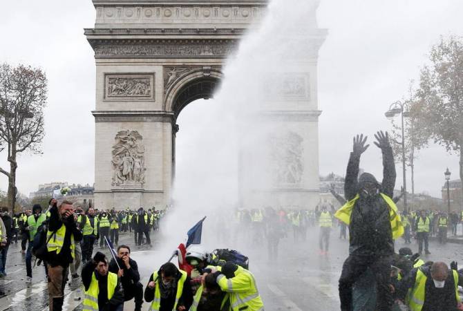 Around 400 arrested, scores injured as France deploys backup police forces into Paris to tackle 
Yellow Vest protests 