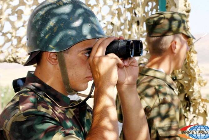 Armenian border guards record dragging away a lying Azerbaijani soldier by fellow servicemen  