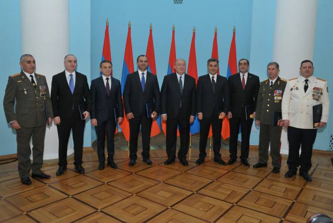 A group of officials bestowed with titles and class ranks at Armenian Presidential Palace