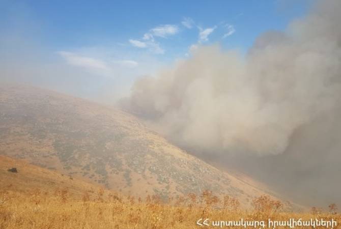Armenian firefighters combat massive wildfire near Mount Ara as flames spread into adjacent 
province
