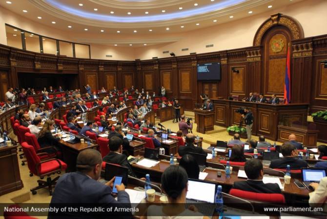 Parliament adopts opposition’s amendments into law on MP guarantees of activities 