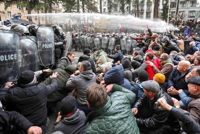 Riot police use water cannons to disperse protesters in Tbilisi 