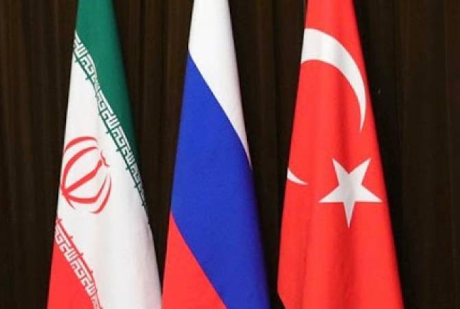 Russia, Turkey and Iran working to agree on date for Syria summit