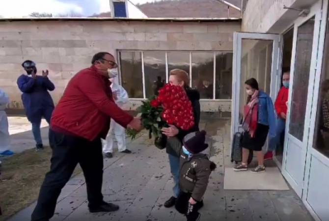 Health workers gift flowers to coronavirus contacts after 14-day quarantine in Armenian town
