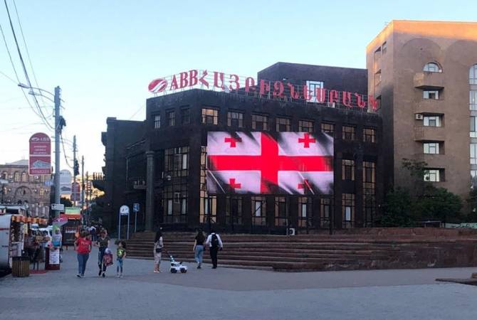 Yerevan billboards lit up in Georgian flag colors on national day 