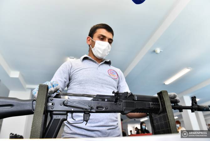 April-war participants assemble Kalashnikov automatic rifles in Armenia