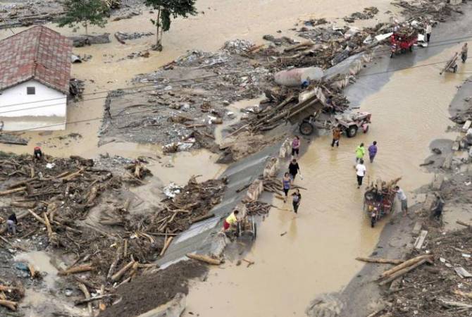 Rescuers search for 9 people missing in central China landslide