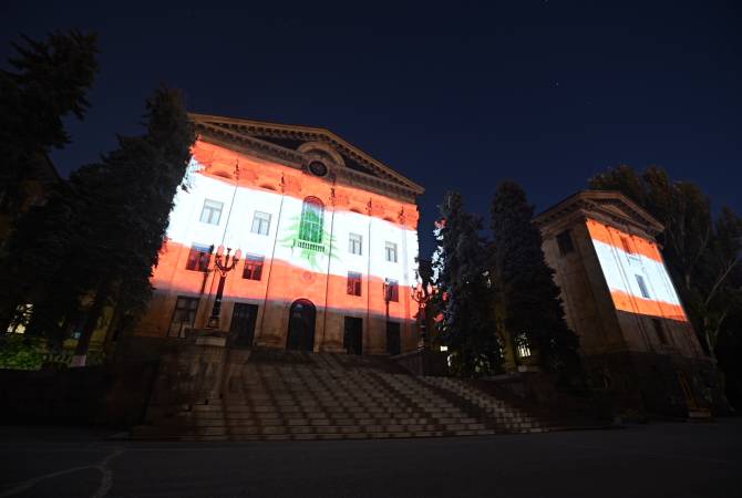 Armenian National Assembly building illuminated with Lebanese flag colors