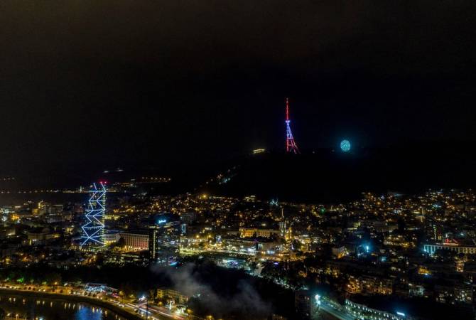 Tbilisi TV Tower lit up in colors of Armenian flag