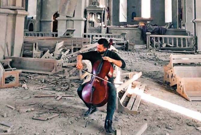 Belgian-Armenian cellist performs Komitas at bombed Ghazanchetsots Church in Artsakh