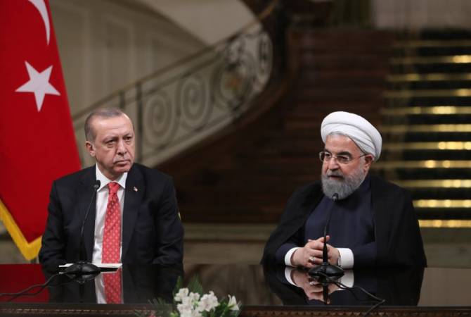Роухани заявил Эрдогану, что Иран в нужное время отомстит за убийство ученого-
ядерщика