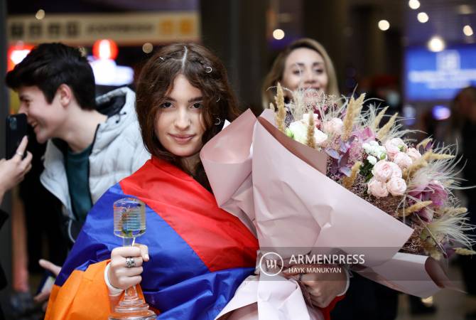 Junior Eurovision winner Malena arrives back in Yerevan to cheering crowds of fans 