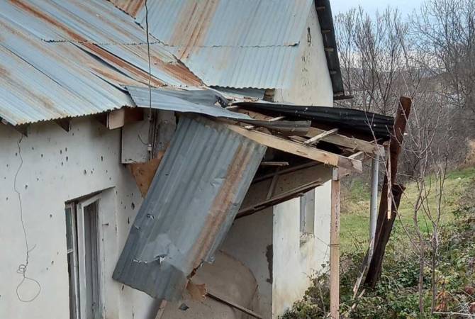 A shell fired by Azerbaijan explodes in the yard of a building in Artsakh’s Parukh community